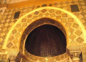 An example of Islamic sacred art : In the Great Mosque of Kairouan in Tunisia, the top of the mihrab (prayer niche) is decorated with 9th century mosaics and painted with intertwined plant motifs.