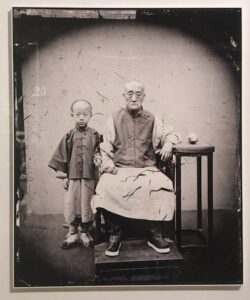 Pioneers of social realism in photography Mandarin with his son