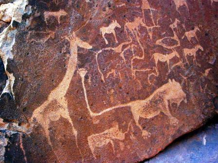 the art of africa petroglife with lion and girafe
